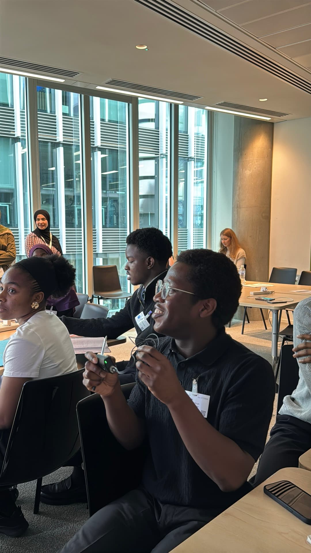 BBB members laughing together around tables at a community event